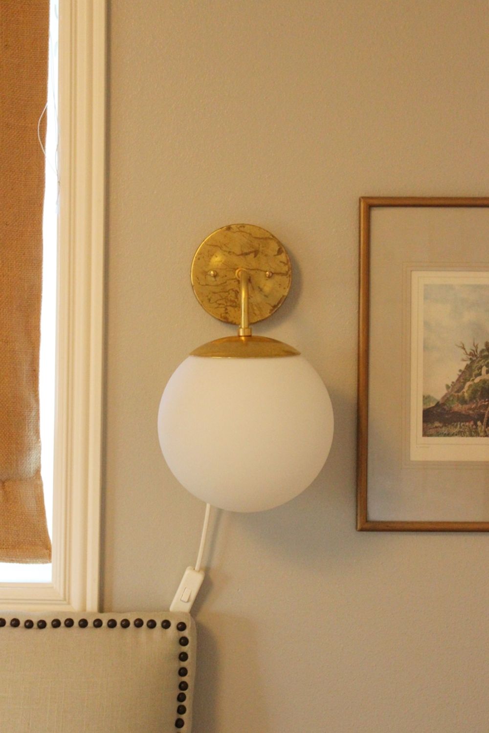 DIY Globe Wall Sconce Above Sofa