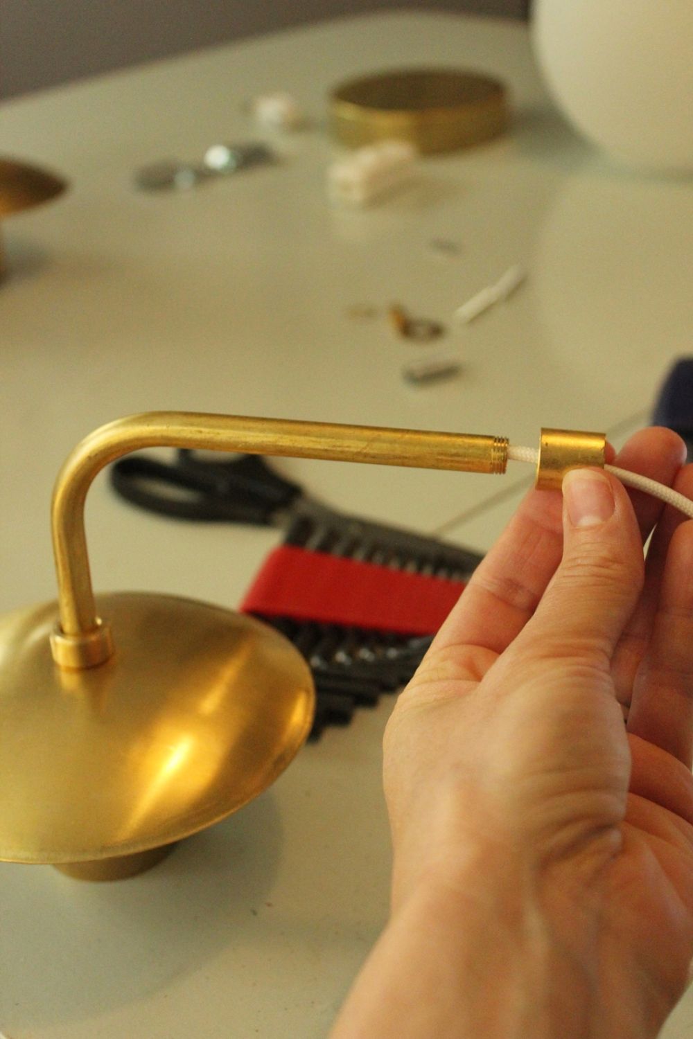 Slide the brass neckless ball holder pieces